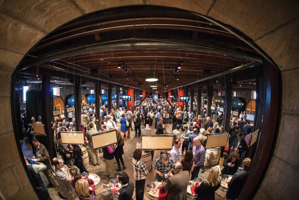 The barrel room at the Culinary Institute of America was packed with trade sampling the lots for the auction.
