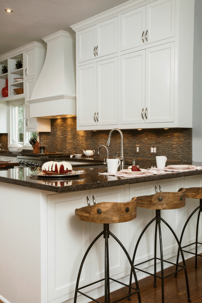Fun rustic modern barstools contrast nicely with stark white cabinets in the kitchen.