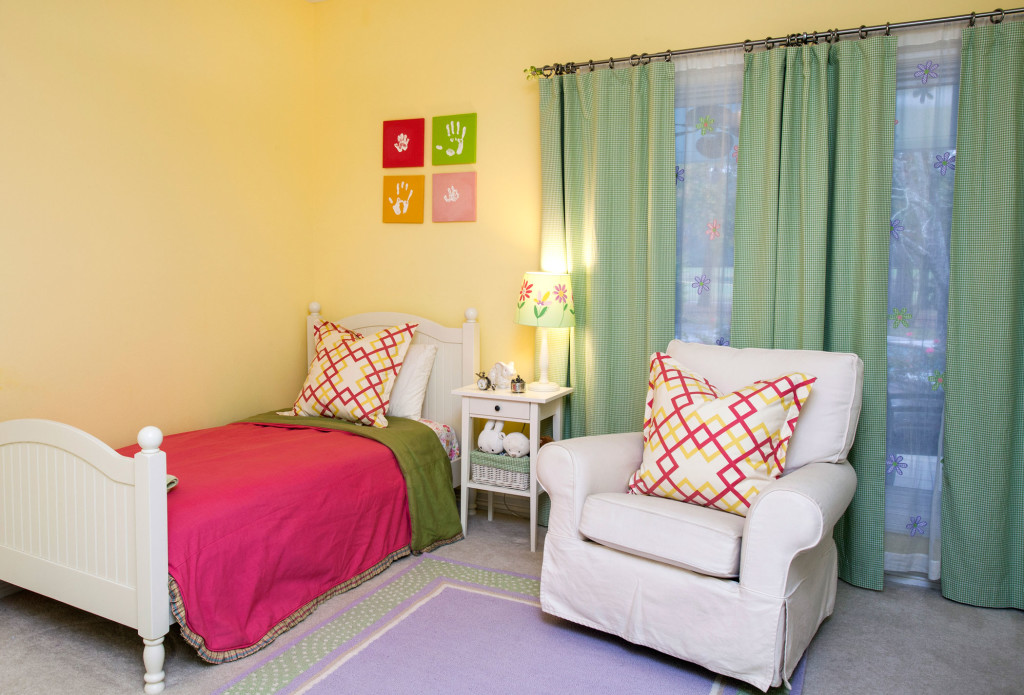 This bedroom says “all girl” in its bright, fun  colors and prints.