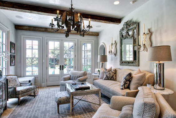 In the sitting room, the Luchino linen fabric on club chairs is from Clarence House. Rug from Stark, lamps from Boxwood Interior. Plaster by Segreto.
