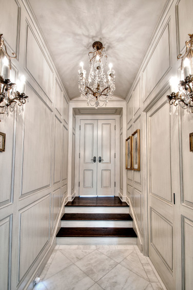 Leading from the bedroom to the master bath, this vestibule was glazed and bits of aged silver leafing were added to the rounded details for a touch of glamour. Sources: Glazed walls and plastered ceiling by Segreto.