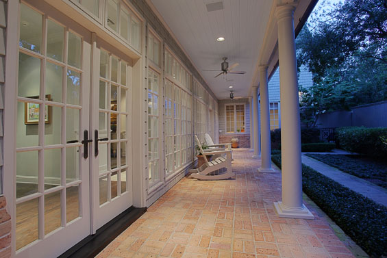 The back porch is pleasing in its simplicity. Stacey enhanced the space by matching the mortar with the trim, which is a design trick to enlarge a smaller outdoor space.