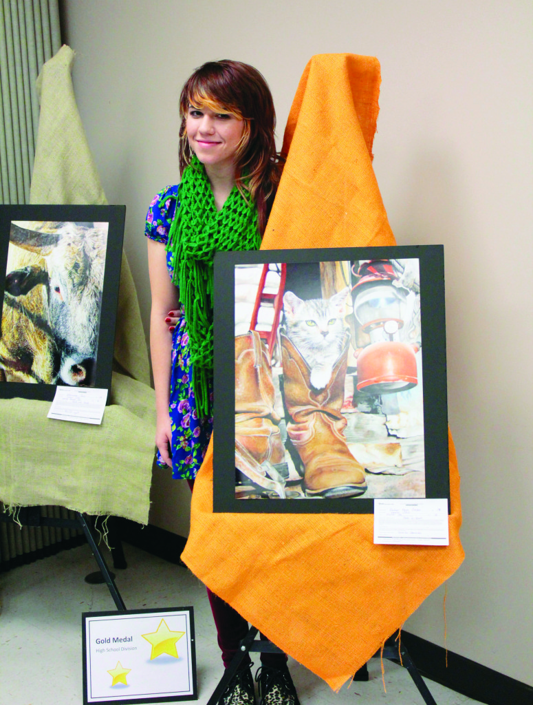 Rachael Faye Becker with her artwork, Peek a Boot.