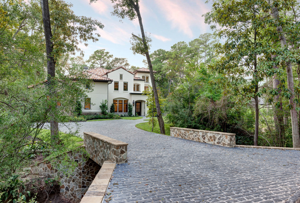 The spectacular driveway clearly forecasts the distinctive nature of this California Mediterranean abode.