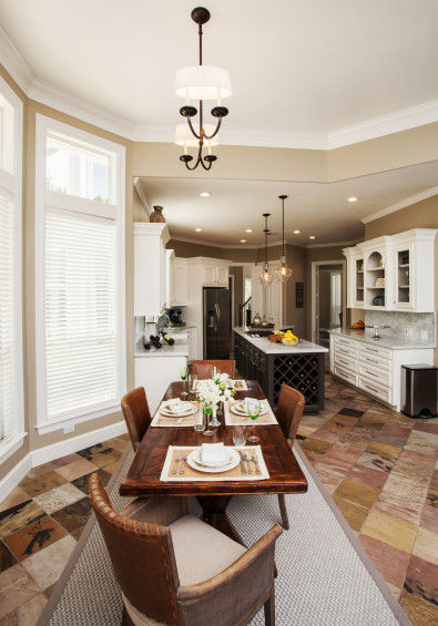 A spacious breakfast room looks into the remodeled kitchen, replete with new wine rack.