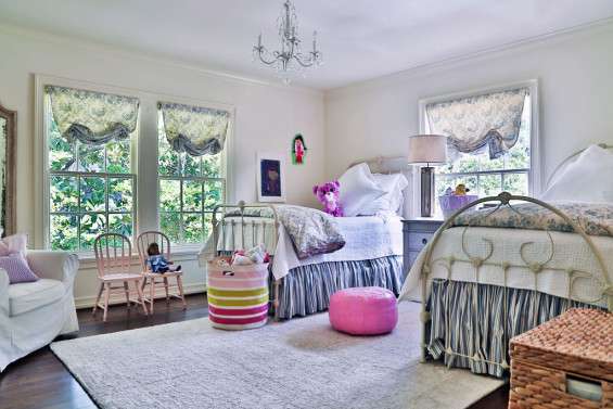 Iron twin beds and beautiful bedding in their 8-year-old daughter’s bedroom were purchased from the former occupants. It’s a light and bright space, perfect for their daughter and her friends.
