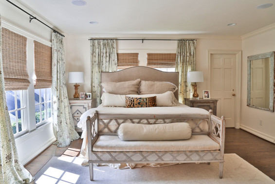 The master bedroom exudes a soft, elegant vibe with bedding from Kuhl Linscomb and Gustavian bench from Twenty Six Twenty.