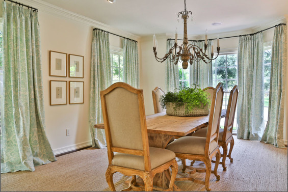 A Swedish table and chairs from MAI look fetching on the dining room’s sea grass rug. Custom draperies and a fern-filled neoprene basket centerpiece from FOUND add a touch of color.