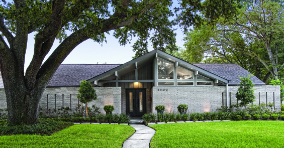 Landscaping follows the simple lines of the original architecture. Brick slits in the courtyard can be seen from this view.