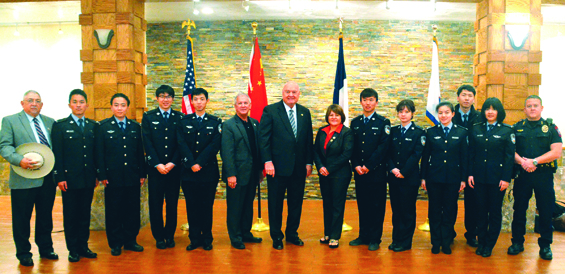 (L-R): City of Rosenberg council member Jimmie Pena; Zhou Xin "Oscar"; Ye Chaoran "Bruce"; Zhou Dongqi "Alfred"; Huang Lingfeng "Oliver"; Dallis Warren, Rosenberg Chief of Police; County Judge Bob Hebert; City of Rosenberg Mayor Cynthia McConathy; Ma Yunzhao "William"; Huang Danqing "Catherine"; Zhang Min "Zephyrus"; Wang Chaoyang "John"; Chen Ruyi "Connie"; and Lt. Wayne Jory.