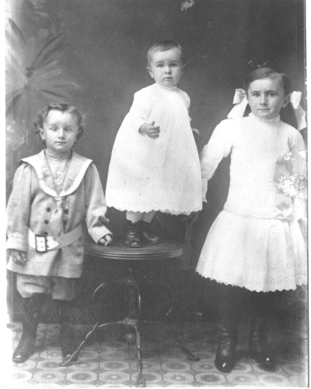 Copy photograph of three children.
